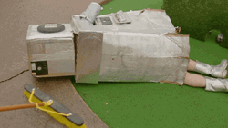 Sweeping Person Laying On The Floor GIF