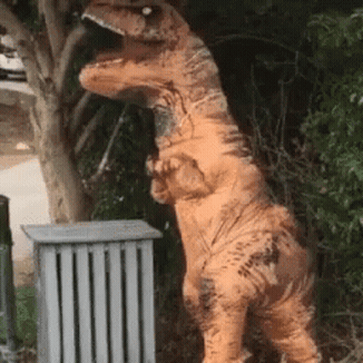 T-Rex Costume Standing By Trash Can GIF