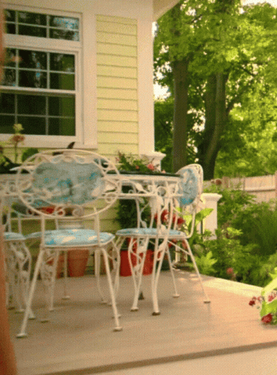 Table And Chairs On Porch With Trees GIF
