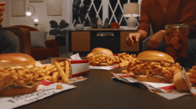Table Full Of Chicken Sandwiches And Fries With Chicken Box GIF