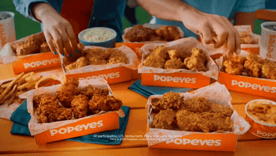 Table Topped With Popeyes Chicken And Fries GIF
