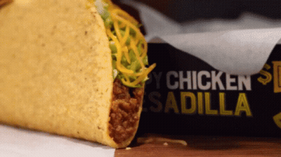 Taco Next To Box Saying Chicken Sadilla GIF