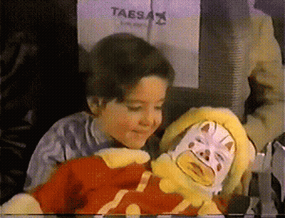 Taesa Sign Behind Child And Stuffed Clown GIF