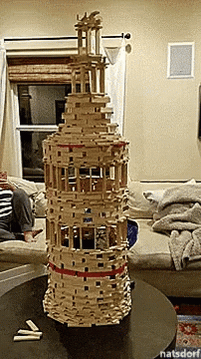 Tall Wooden Block Tower On Table GIF