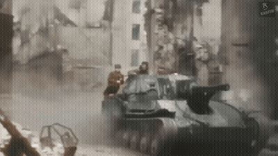 Tank Driving Through City Street GIF