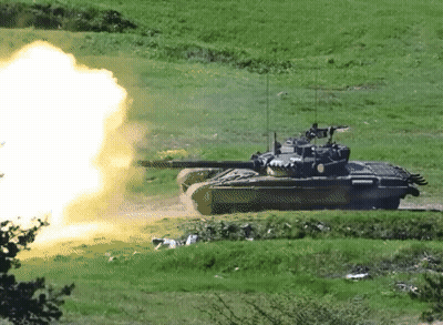 Tank Firing Rocket In Grass Field GIF