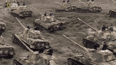 Tanks Lined Up In Field With National Geographic Logo GIF