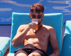 Tanning And Relaxing With Beer GIF