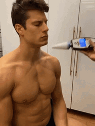 Tanning Spray On Guy's Face GIF