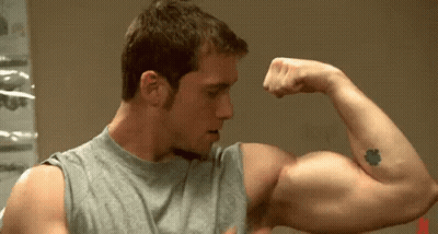 Tattooed Man Flexing Arm