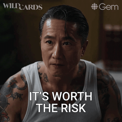 Tattooed Man In White Tank Top Says It's Worth The Risk GIF