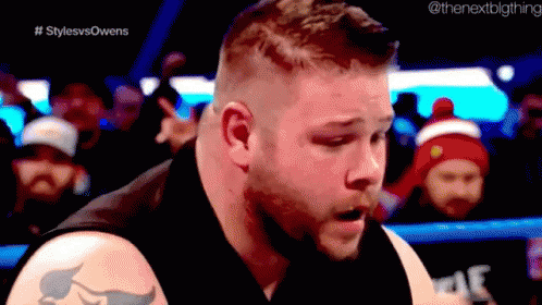Tattooed Man In Wrestling Ring With Crowd GIF