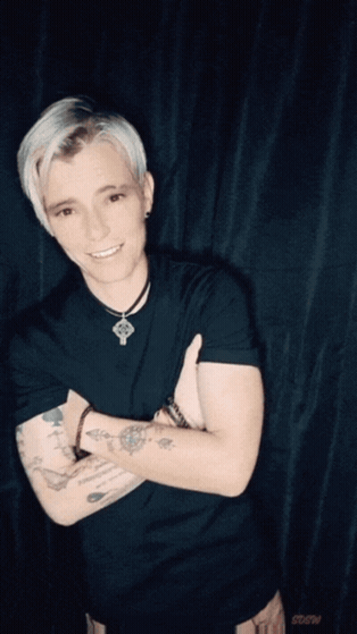 Tattooed Man Lifted By Another Man GIF