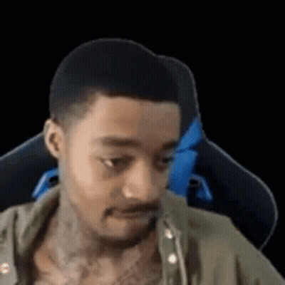 Tattooed Man Sitting In Chair GIF