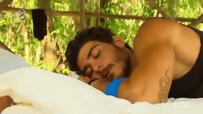 Tattooed Man Sleeping On Bed GIF