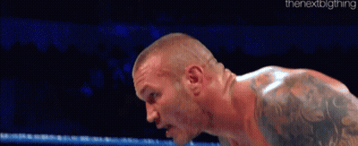 Tattooed Shirtless Wrestler Standing In Ring GIF