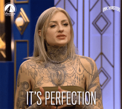 Tattooed Woman Says It's Perfection On A Screen GIF