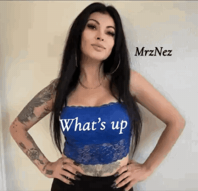 Tattooed Woman Wearing Blue Lace Top Saying Whats Up GIF
