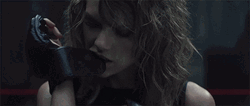 Taylor Swift Bites Gloves GIF