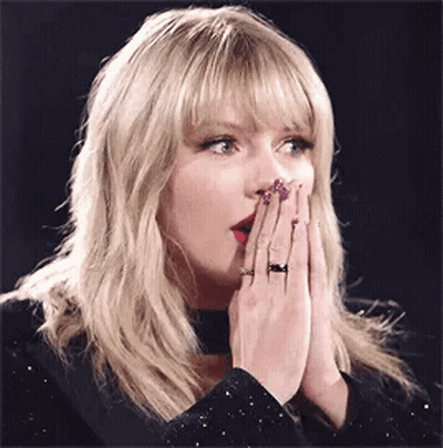 Taylor Swift Covering Mouth With Hands And Choker GIF