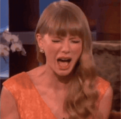 Taylor Swift Crying On Talk Show In Orange Dress GIF