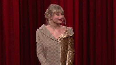 Taylor Swift Dancing On Stage In Suit And Dress GIF