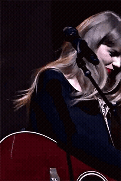 Taylor Swift Holding Guitar And Waving GIF