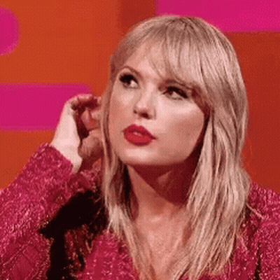 Taylor Swift In Pink Dress Hand To Ear GIF