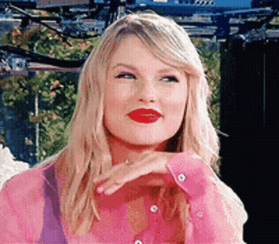 Taylor Swift In Pink Shirt Making Funny Face GIF