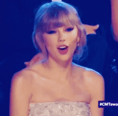 Taylor Swift In Strapless Dress Making A Face GIF