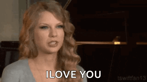 Taylor Swift Is Making A Funny Face While Saying I Love You . GIF