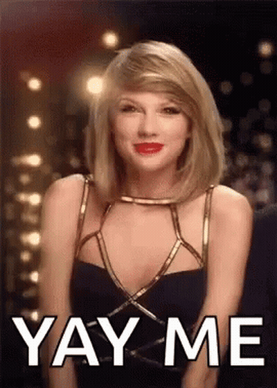 Taylor Swift Is Wearing A Black Dress And Red Lipstick And Is Making A Funny Face . GIF