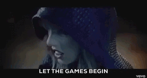 Taylor Swift Is Wearing A Blue Sweater And A Hooded Jacket In The Video For Her Song Let The Games Begin . GIF