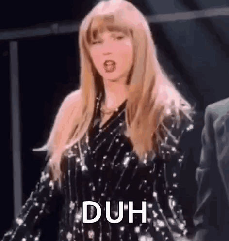 Taylor Swift Is Wearing A Sequined Dress And Dancing On Stage . GIF
