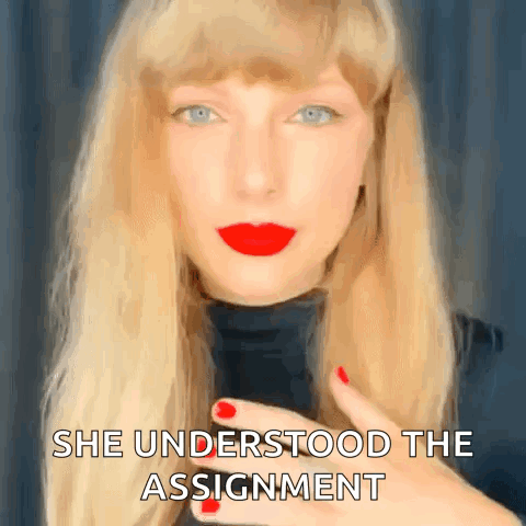 Taylor Swift Is Wearing Red Lipstick And A Black Turtleneck And Is Giving A Kiss . GIF