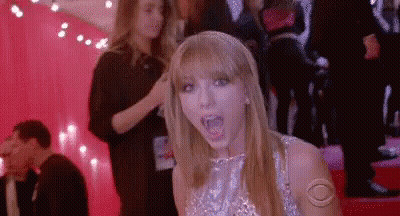 Taylor Swift Making Funny Face On Red Carpet GIF