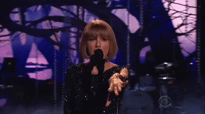 Taylor Swift Singing Into Microphone On Stage GIF