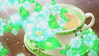 Tea Cup With Blue Flowers And Green Leaves GIF