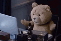 Ted In Front Of Desk GIF