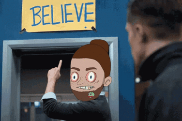 Ted Lasso Animated Head Pointing Believe Sign GIF