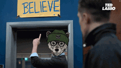 Ted Lasso Animated Wolf Head Points Believe Sign GIF