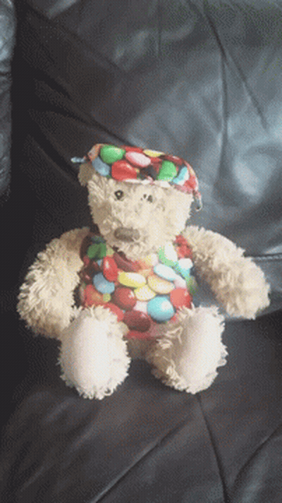 Teddy Bear In Colorful Candy Outfit GIF