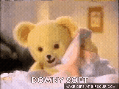 Teddy Bear Lying On Bed Downy Soft GIF