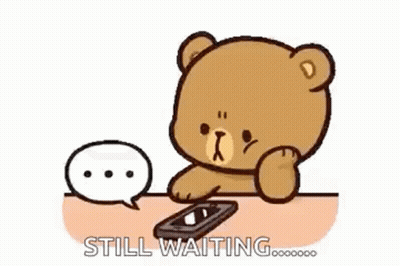 Teddy Bear Sitting At Table With Cell Phone And Speech Bubble GIF