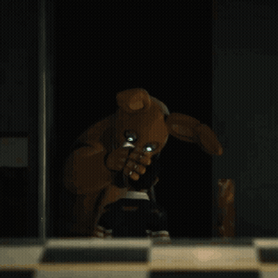 Teddy Bear With Bunny Ears In The Dark GIF