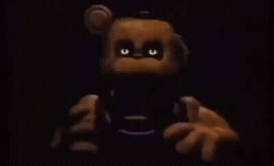 Teddy Bear With Glowing Eyes Holding Remote Control GIF