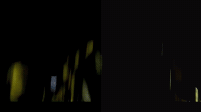 Teddy Bear With Glowing Eyes In Dark Room GIF