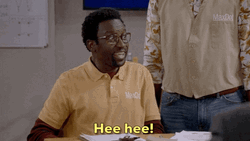 Tee Hee Cackling Black Guy In Yellow Tee GIF