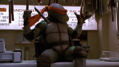 Teenage Mutant Ninja Turtle Holding Knife Near Menu GIF