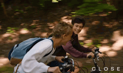 Teenager Boys Riding Bike Happily GIF